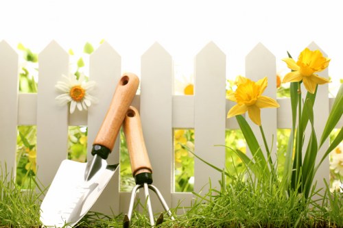 Close-up of hands tending plants, symbolising inclusive gardening services